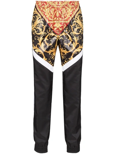 Shop Versace Panelled Baroque Print Track Pants In Red