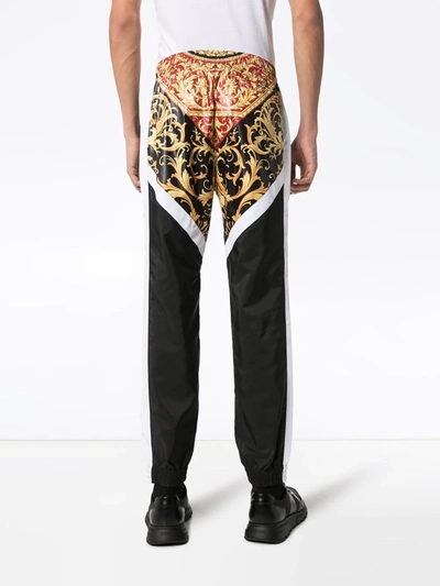 Shop Versace Panelled Baroque Print Track Pants In Red