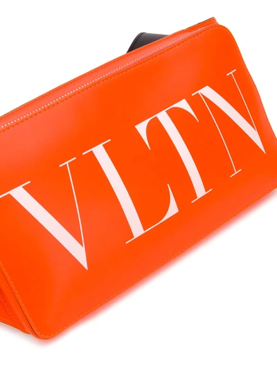 Shop Valentino Vltn Logo-print Belt Bag In Orange