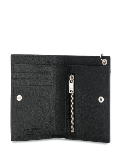 Shop Saint Laurent Embossed Logo Chain Wallet In Black