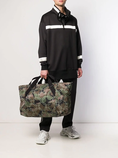 Shop Valentino Vltn Camouflage-print Holdall In Green