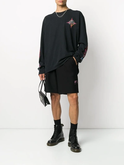 Shop Rhude Logo Print Long-sleeved T-shirt In Black