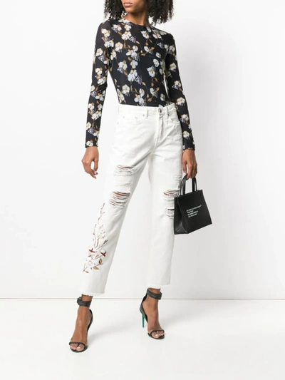 Shop Off-white Distressed Flowers Jeans In White