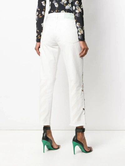 Shop Off-white Distressed Flowers Jeans In White