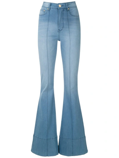 Shop Amapô Wanda Flared Jeans In Blue
