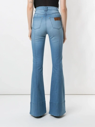 Shop Amapô Wanda Flared Jeans In Blue