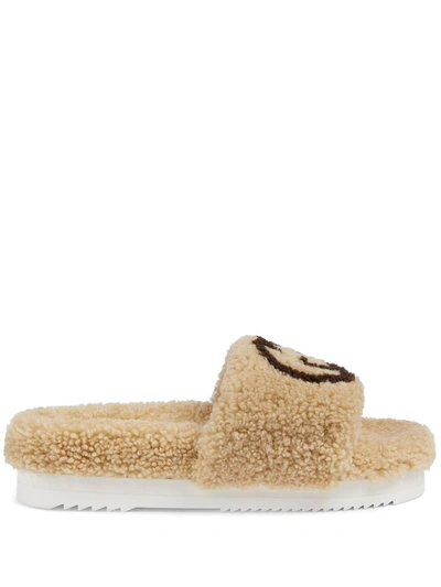 Shop Gucci Interlocking G Shearling Slides In Neutrals