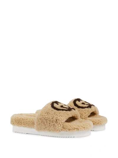 Shop Gucci Interlocking G Shearling Slides In Neutrals