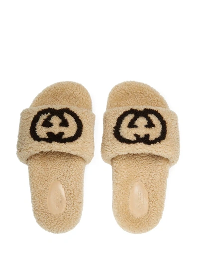 Shop Gucci Interlocking G Shearling Slides In Neutrals