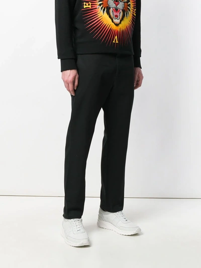 Shop Gucci Logo Stitched Tailored Trousers In Black