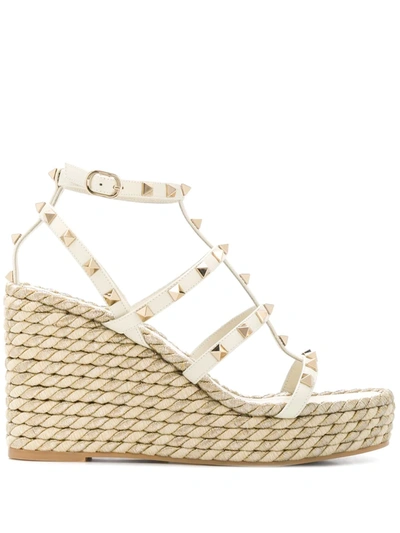 Shop Valentino Rockstud 95mm Wedge Sandals In Neutrals