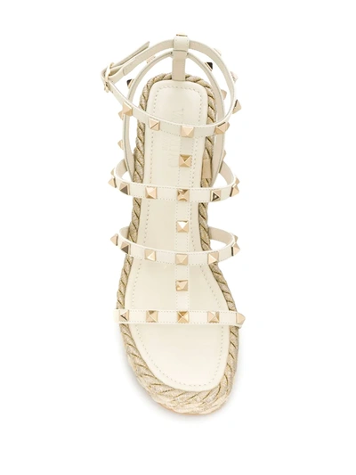Shop Valentino Rockstud 95mm Wedge Sandals In Neutrals