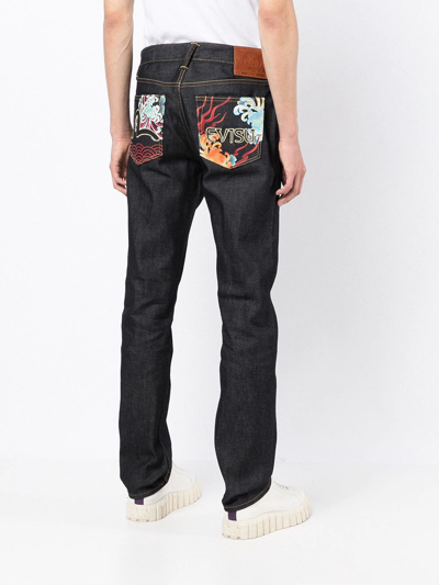 Shop Evisu Contrasting-panel Jeans In Blau