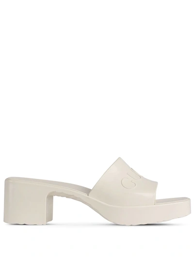 Shop Gucci Logo Embossed Sandals In White