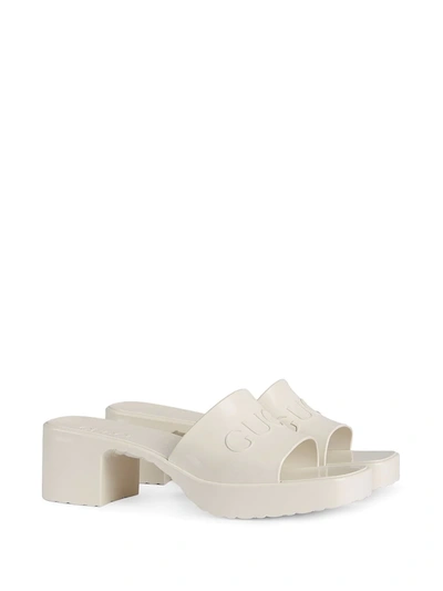 Shop Gucci Logo Embossed Sandals In White