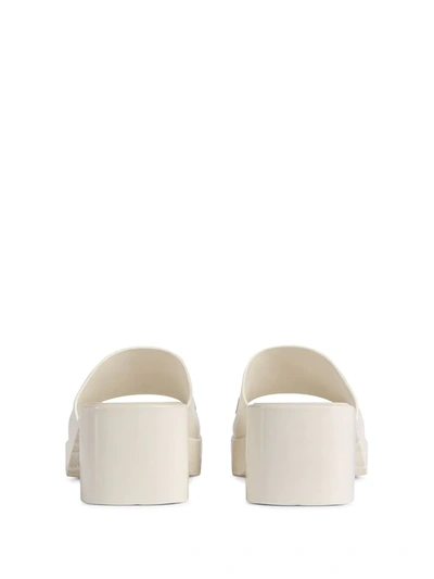 Shop Gucci Logo Embossed Sandals In White