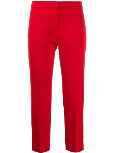 Shop Alexander Mcqueen Slim-fit Cropped Trousers In Red