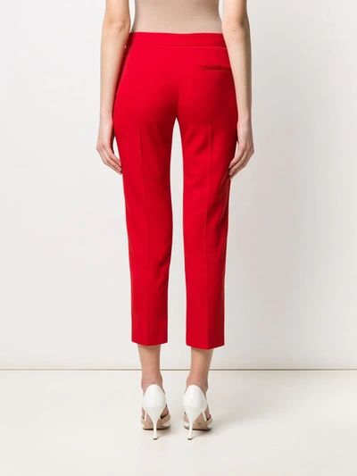 Shop Alexander Mcqueen Slim-fit Cropped Trousers In Red