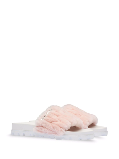 Shop Miu Miu Matelassé Shearling Slides In Pink