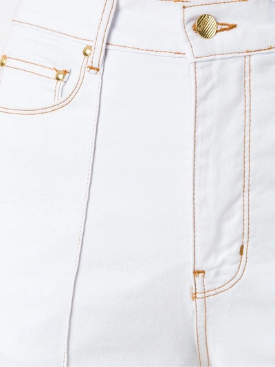 Shop Amapô High Waist Flared Jeans In White