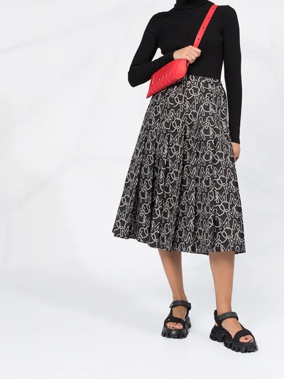 Shop Moncler Logo Print Pleated Skirt In Black