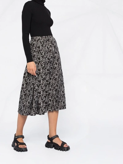 Shop Moncler Logo Print Pleated Skirt In Black