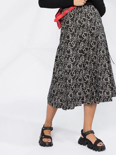 Shop Moncler Logo Print Pleated Skirt In Black