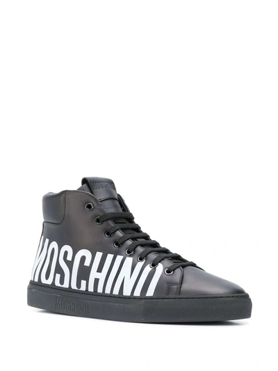 Shop Moschino Logo Print Hi-top Sneakers In Black