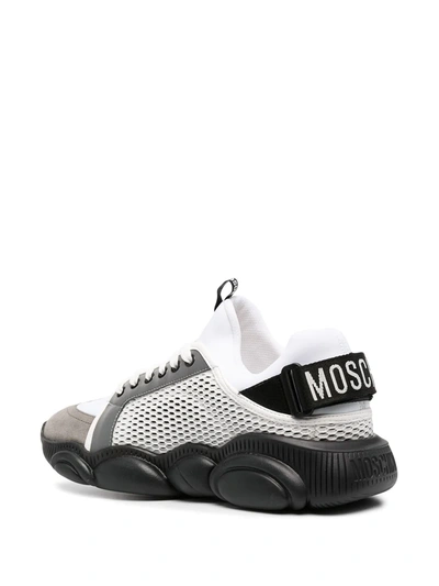 Shop Moschino Logo-strap Teddy Sneakers In White