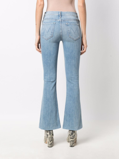 Shop Mother The Weekender Flared Cropped Jeans In Blue