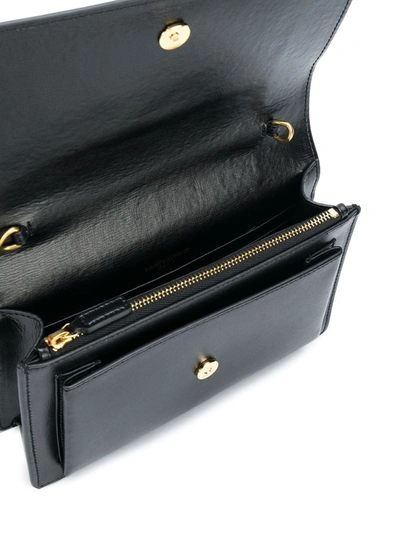 Shop Saint Laurent Cassandra Leather Cross Body Bag In Black