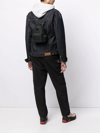 Shop Mcm Micro Stark Stud-embellished Backpack In Black