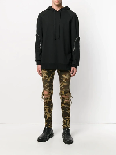 Shop Balmain Distressed Camouflage Trousers In Green