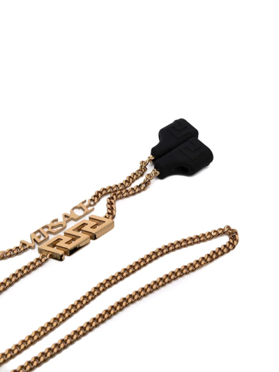 Shop Versace Greca Wireless Headphone Strap In Gold