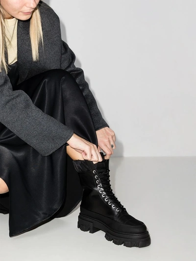 Shop Ganni Lace-up Ridged Sole Boots In Black