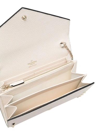 Shop Valentino Rockstud Clutch In Neutrals