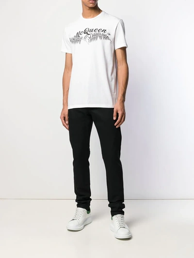 Shop Alexander Mcqueen Logo Embroidered Slim Jeans In Black