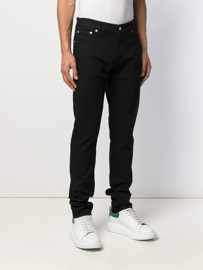 Shop Alexander Mcqueen Logo Embroidered Slim Jeans In Black