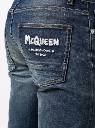 Shop Alexander Mcqueen Mcqueen Graffiti Denim Jeans In Blue