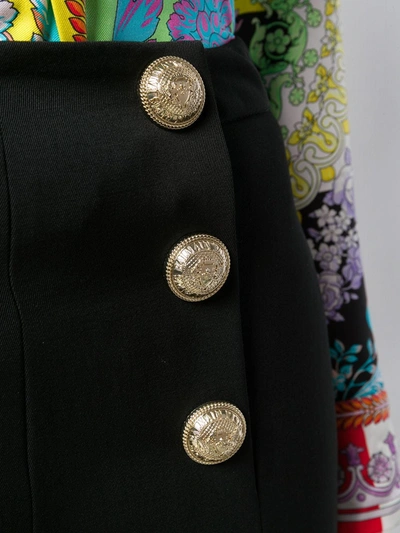 Shop Balmain Cropped Logo Button Trousers In Black