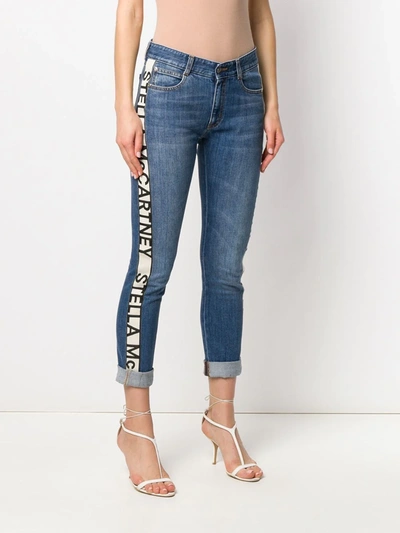 Shop Stella Mccartney Logo-stripe Cropped Jeans In Blue