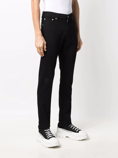 Shop Alexander Mcqueen Embroidered-logo Straight-leg Jeans In 黑色