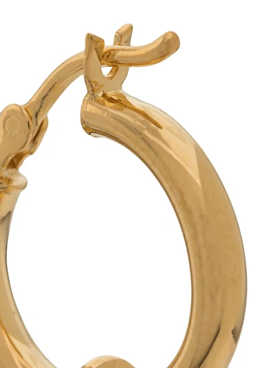 Shop Northskull Skull Safety Pin Hoop Earring In Gold