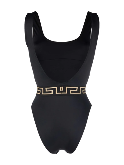 Shop Versace Greca Medusa Print Swimsuit In Schwarz