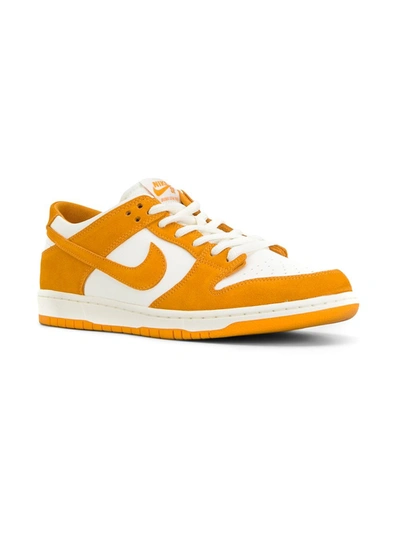 Shop Nike Dunk Low Sneakers In Orange