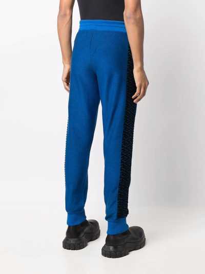 Shop Versace La Greca Track Pants In Blue