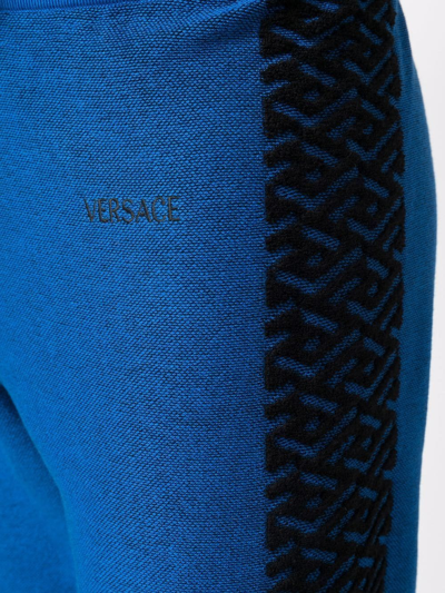 Shop Versace La Greca Track Pants In Blue