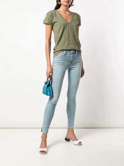 Shop Frame Le High Skinny Crop Slit Rivet Jeans In Blue