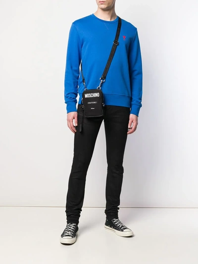 Shop Moschino Contrast Logo Shoulder Bag In Black