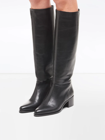 Shop Prada Pointed Toe Knee High Boots In Black
